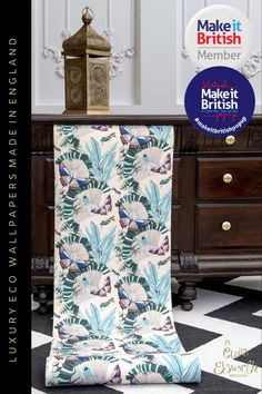 an advertisement for make it british featuring a blue and white patterned blanket with tropical leaves