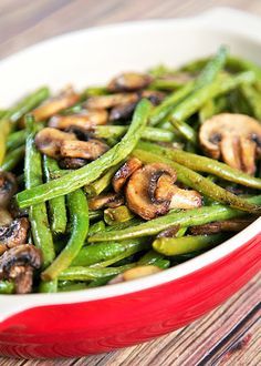 roasted green beans and mushrooms in a red dish