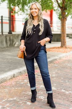 Switch up your style with this top! Featuring button detailing on the bust and sleeves, this lightweight henley-style knit top is perfect for adding some flair to your wardrobe. Stand out from the crowd and tell your own unique story with this playful and fun top! 96% Rayon, 4% Spandex Casual Black Henley For Fall, Casual Long Sleeve Top With Buttons For Fall, Casual Henley Blouse For Fall, Casual Henley Neckline Blouse For Fall, Trendy Knit Top With Button Closure, Casual Long Sleeve Top With Button Closure For Fall, Casual Blouse With Buttons And Henley Neckline, Chic Henley Neckline Tops For Fall, Casual Henley Neckline Long Sleeve Top For Fall