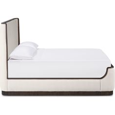 a bed with a white and brown headboard on it's side, in front of a white background