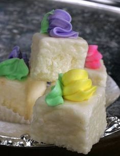 three pieces of cake sitting on top of a silver plate