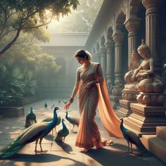 a woman in a sari walking with peacocks around her and statues behind her