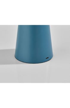 a blue cone sitting on top of a white table