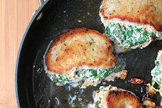 some food is cooking in a pan on the table