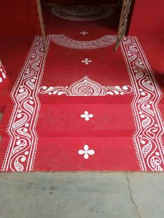 red steps with white designs painted on them