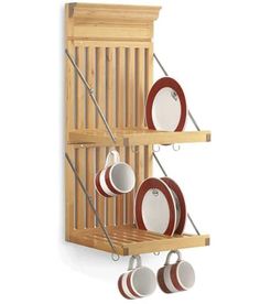 a wooden shelf with pots and pans hanging from it's sides on the wall