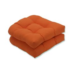 two orange cushions sitting on top of each other