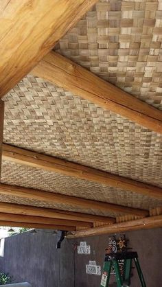 the inside of a house with wood beams and rafters on it's roof