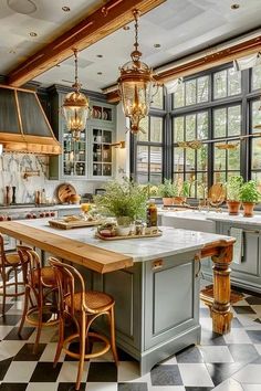 a kitchen with checkered flooring and lots of lights hanging from the ceiling over the island