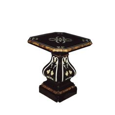 a black and gold table with an ornate design on it's top, against a white background