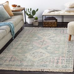 a living room filled with furniture and a rug