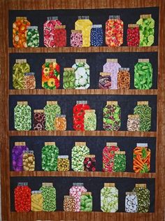 a quilted display filled with lots of different types of candy