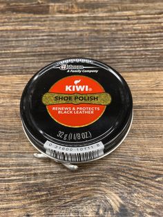 kiwi shoe polish on a wooden table