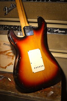 an electric guitar sitting on top of a table