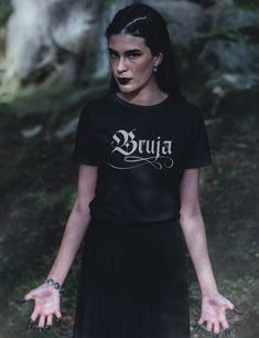 Unleash your inner power with the Bruja Shirt. Designed for witchy souls and modern mystics, this shirt is crafted from 100% breathable cotton, flawlessly merging witchcraft aesthetics with contemporary comfort. Elevate your everyday style and embrace your spiritual journey with this unique addition to your wardrobe staples. Choose from a variety of plus sizes up to 5XL for a roomy fit, or size up for an oversized look. Surprise any of your witchy friends with a gift they would love! Breathable Witchy Friends, Witchy Aesthetic, Inner Power, Aesthetic Shirts, Witch Aesthetic, Unisex Tshirt, Spiritual Journey, Everyday Wardrobe, Halloween Shirt