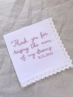 a white hanker with pink writing on it that says thank you for saying the name of my dreams