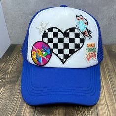 Step up your hat game with this wild bight blue trucker hat with black and white checkered heart, blue butterfly, hot pink peace. Smart Strong & Beautiful. SnapBack hat Trendy Blue Hats For Festival, Trendy Blue Hat For Festival, Blue Trucker Cap For Festivals, Blue Trucker Hat For Festival, Playful Blue Trucker Hat For Summer, Blue Fun Snapback Hat For Summer, Fun Blue Snapback Hat For Summer, Fun Blue Adjustable Snapback Hat, Playful Blue Summer Trucker Hat