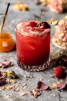 a red drink sitting on top of a table