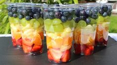 several cups filled with different types of fruit