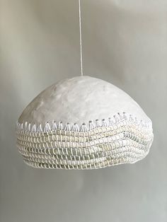 a large white object hanging from a string