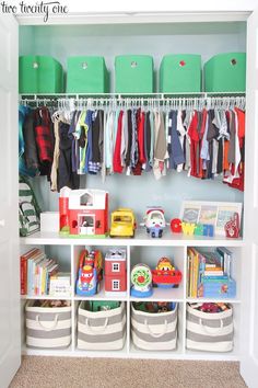 the closet is full of toys and books for children to play with, while storage bins hold their belongings