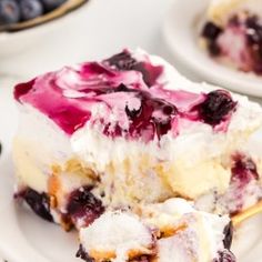 a piece of blueberry cheesecake on a white plate