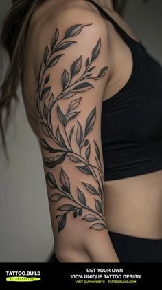 a woman's arm with leaves on it and the words tattoo build written in black ink