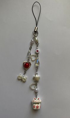 a necklace with charms hanging from it's side