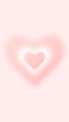 a heart shaped object on a pink background