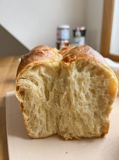 a loaf of bread sitting on top of a cutting board