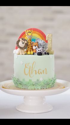 a birthday cake with animals on top