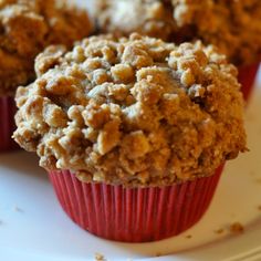 three muffins on a plate with the words dutch apple pie muffins