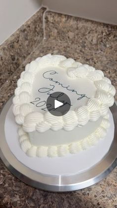 a white cake sitting on top of a counter