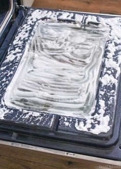 an oven is covered in snow and ice