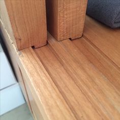 two wood blocks sitting on top of a wooden floor