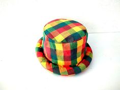 This Rasta Jamaican Bucket hat is perfect for Summer Reggae Festivals. This solid Bucket hat features a Jamaican Rasta Inspired Striped Band atop a solid , Red green yellow Rasta color bucket hat. Rock this hat as you dance the night away at your next outdoor concert or event. Fashionable and a must-have . This Hat is unisex that looks great on both men and women . This Hat is very durable and can be used as a special gift . -Solid Unisex Jamaican Adult Bucket Sun Hat -Rasta Reggae Inspired Stri Multicolor Cap Hat As Gift, Multicolor Cap As Gift, Multicolor Brimmed Hat As Gift, Casual Mini Hat With Short Brim For Gifts, Casual Mini Hat With Short Brim As Gift, Multicolor Curved Brim Hat As Gift, Adjustable Bucket Hat For Festivals, Adjustable Bucket Mini Hat For Festivals, Adjustable Multicolor Bucket Mini Hat