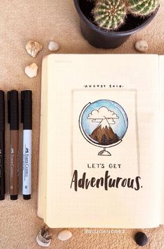 an open notebook with the words let's get adventures written on it next to some pens