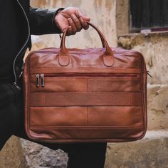 Made for men and women, our Executive Leather Laptop Bag is all about upgrading your work look .High Quality Bags with maximum functionality and minimal design to carry your laptop, files ,documents in a minimal possible way.Features ﻿ Crafted with 100% genuine Cow leather Laptop Compartment Size: Upto 15.5 inch Removable, adjustable padded shoulder strap Rear smart zipper allows you to attach this bag to the extended handles of rolling cases Main compartment has two large sections with one pock Professional Leather Satchel For Everyday Use, Professional Leather Shoulder Bag For Everyday Use, Professional Leather Satchel For Daily Use, Professional Leather Laptop Bag For Everyday Use, Professional Satchel With Leather Lining, Professional Leather Rectangular Satchel, Professional Laptop Bag With Leather Lining For Everyday Use, Professional Rectangular Leather Satchel, Professional Leather Briefcase For Daily Use