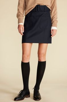 This paneled mini skirt will be a standout in your wardrobe. It features patch pockets on the front for interest and a wide matching belt to accentuate the waist. Our stylist loves it with bare legs and loafers or tights and high boots. DESIGN- Slim fit. Size up for a more relaxed look.- A paneled mini skirt with fitted waist and patch pockets on the front.- Detachable wide belt with fabric covered buckle, hidden side zipper.- Length: 17 5/8" FABRIC & CARE- 50% polyester, 50% RWS wool- Lining: 1 Fitted Blue Mini Cargo Skirt, Mini Cargo Skirt For Workwear, Navy Skort For Workwear, Workwear Mini Skirt With Pockets, Fitted Short Cargo Skirt For Work, Navy Fitted Skort For Workwear, Mini Length Lined Cargo Skirt For Workwear, Short Lined Cargo Skirt For Workwear, Mini Cargo Skirt Lined For Workwear