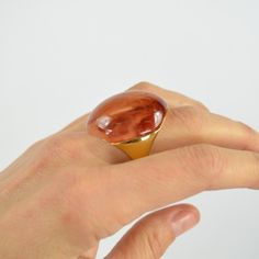 This Ks Mood Rings Features Vibrant Shades Of Resin Set In Gold-Tone Metal That's High On The Shine Scale. Pick A Color (Or A Few) That Speaks To You, And Style It With The Other Rings From Your Dish. Handcrafted Size 6 Weight: 20.35g Diameter Of Setting: 0.75" Band Width: 1" Ring Does Not Change Color Ks_ring_moon_br_6 Modern Brown Rings For Gift, Modern Brown Rings For Gifts, Kate Spade Elegant Gold Ring, Elegant Kate Spade Gold Rings, T Ring, Mood Rings, Ring Moon, Pick A Color, Mood Ring