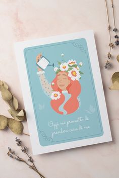 a card with an image of a woman holding a watering can and flowers in her hair