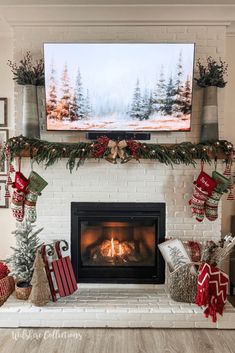 a fireplace decorated for christmas with stockings and presents