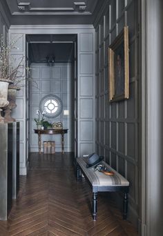 the hallway is decorated in gray and wood