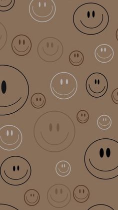 a brown background with lots of smiley faces