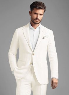 Immerse yourself in the blend of timeless elegance and modern flair with the Stylbiella Cream Linen Suit, a piece that radiates sheer magnificence. Crafted from the highest quality pure linen, this suit is a testament to subtle luxury, offering an exquisite, silky smoothness that feels as serene as it looks. The suit's cream color, enriched with a refined textured finish, makes for an impressive visual statement, ensuring you stand out in any setting. Designed with a focus on relaxed sophisticat Cream Linen Suit For Semi-formal Occasions, Luxury White Notch Lapel Sets, Timeless Single-breasted Wedding Suit, Elegant White Single-breasted Set, Timeless Linen Suit, Timeless Cream Suits, Luxury White Linen Suits, Modern Fitted Linen Suits, Luxury White Linen Blazer