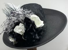 VICTORIAN WIDE BRIM HAT - 1122 Custom made wide brim black hat with black lace covering the crown, black lace bow, gorgeous black and white Roses, Ostrich and Peacock feathers. SIZE:  Medium, 22" - 22 1/2" inches for the head circumference.            There is an adjustable drawstring sweatband to adjust the fit if needed.  Please measure your head to make sure the hat will fit. No guessing please.  No returns if it does not fit. All heads are not the same. This hat will be made for you after yo Black Hat Bands For Kentucky Derby With Curved Brim, Black High Crown Hat For Races, Black Top Hat For Kentucky Derby, Black Hat Bands For Spring Party, Black Hat Bands For Party In Spring, Black Fedora Mini Hat For Wedding, Elegant Black Hat Bands For Kentucky Derby, Fitted Black Hat Bands For Kentucky Derby, Victorian Tea Party