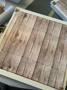 some wood planks sitting on top of a table