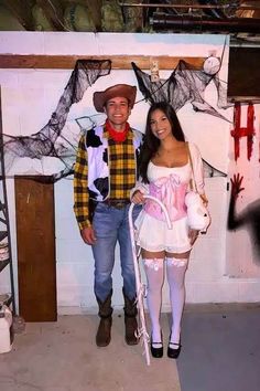 a man and woman dressed up in costumes