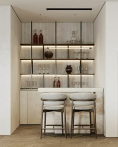 two bar stools in front of a counter with bottles and glasses on the shelves