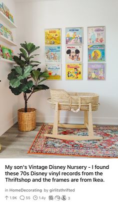 a room with posters on the wall and a potted plant